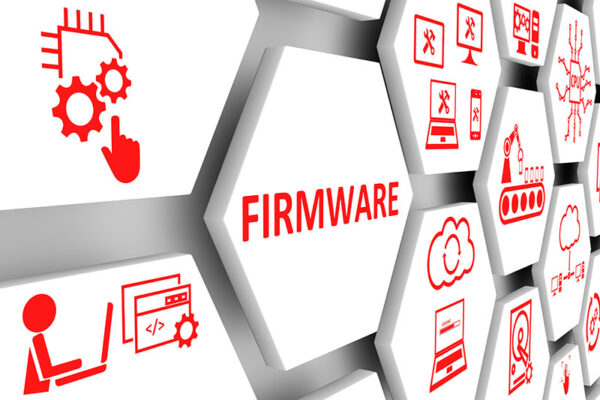 Hexagonal tiles with red tech and coding icons, including gears and computer screens, surround the word "FIRMWARE" in bold red letters. Firmware is at the center of secure smart meters.
