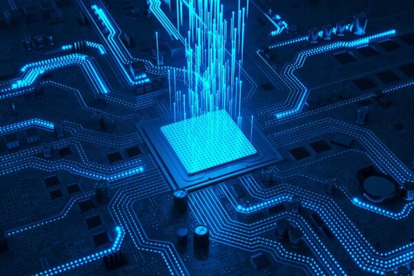 Blue light beams shoot upward from a glowing microchip on a circuit board, representing edge AI.