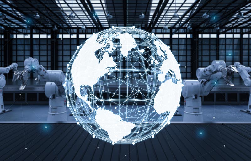 A digital globe with connected nodes is superimposed over a factory floor with robotic arms.