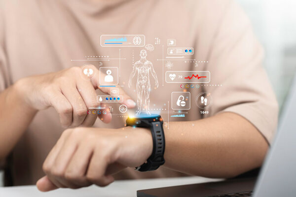 A person interacts with a smartwatch powered by 5G RedCap. It displays overlaid graphics of digital health and fitness metrics.