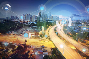 A city skyline with highways at dusk, overlaid with digital icons representing technology, connectivity, and smart infrastructure systems.