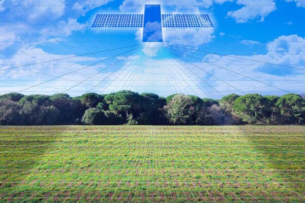 A digital illustration of a large satellite above a grassy field and trees, projecting grid-like data lines onto the landscape under a blue sky.