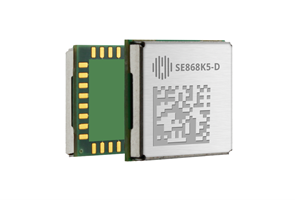 A small rectangular electronic module with a metallic surface, gold connectors on the side, printed code, and the label "SE868K5-D.