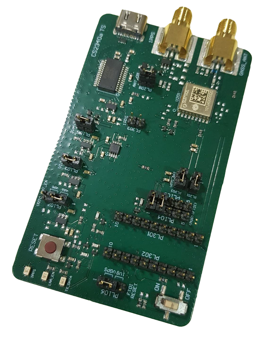 A green printed circuit board with various electronic components, including chips, connectors, switches, a USB port, and gold-plated coaxial connectors.