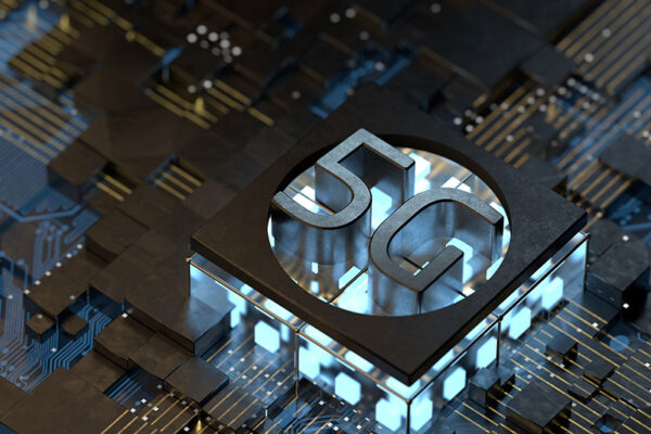 A computer chip with a 5G logo sits on a circuit board.