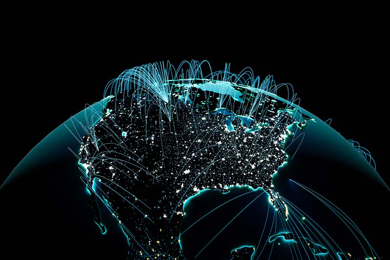 Digital illustration of North America at night with glowing city lights and blue lines representing data or network connections across the continent.