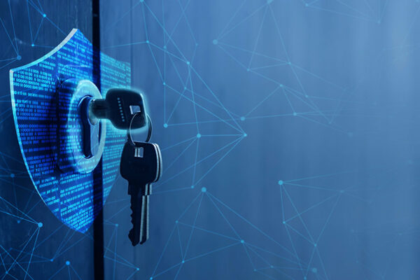 An illustration of a set of keys inserted into a digital shield-shaped lock filled with indecipherable writing, symbolizing IoT security and data protection.