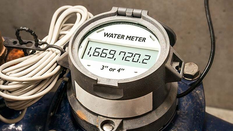A close-up of a digital water meter displaying a reading of 1,669,720.2.