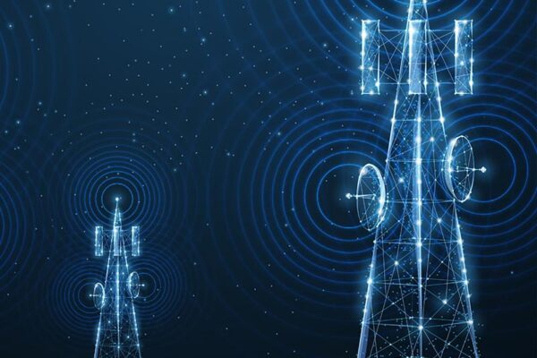 Two digitally illustrated radio towers emit signal waves, symbolizing communication technology.