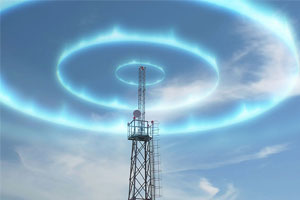 A telecommunications tower stands against a blue sky, surrounded by two bright, glowing circular rings of light.