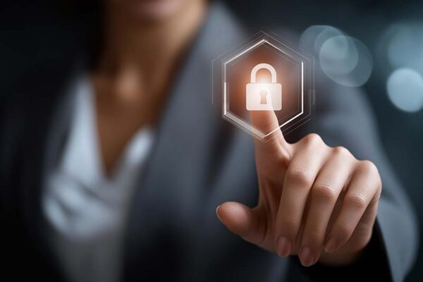 A person in business attire touches a digital lock icon on a virtual screen, symbolizing CRA vulnerability reporting.