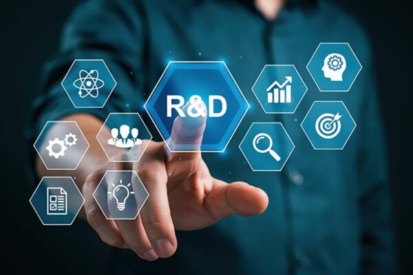 A person touches a virtual hexagonal icon labeled "R&D," surrounded by other icons representing science, teamwork, growth, analysis, and innovation.