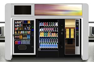 A commercial vending machine station with two glass-fronted snack and drink units and one coffee dispenser.